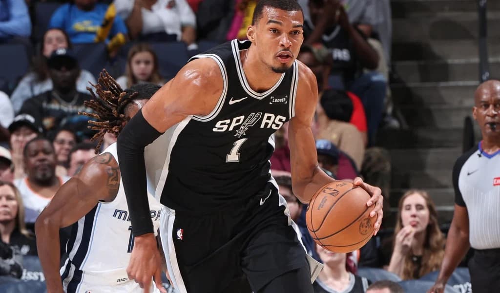 Victor Wembanyama pushes the ball up the floor for the Spurs