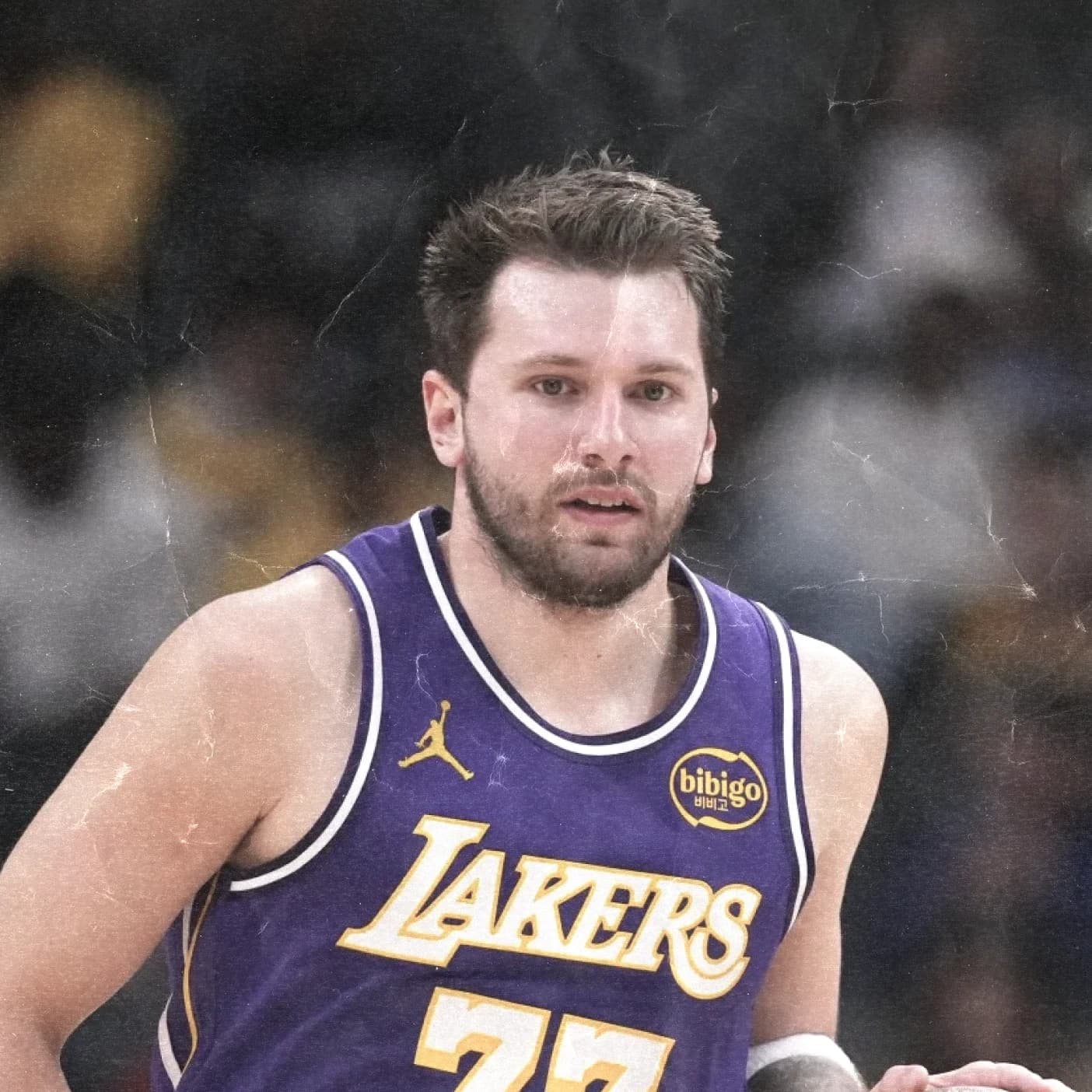 Luka Doncic brings the ball up in a purple Lakers jersey