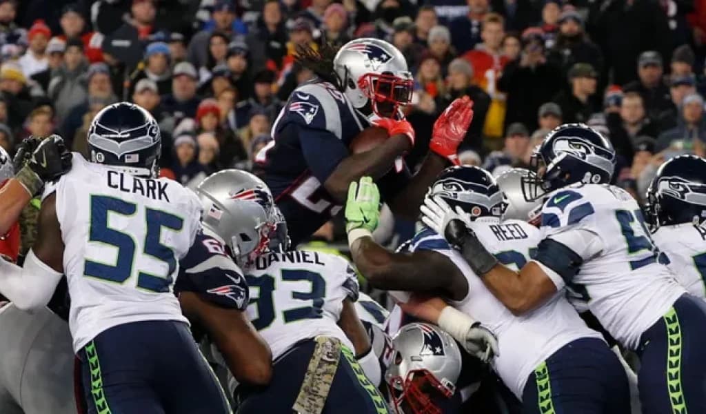 New England Patriots running back leaps over the pile at the goal line against the Seattle Seahawks