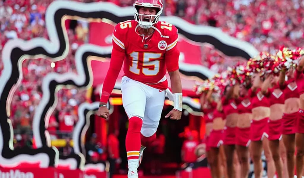 Patrick Mahomes of the Kansas City Chiefs runs out of the tunnel past cheerleaders.