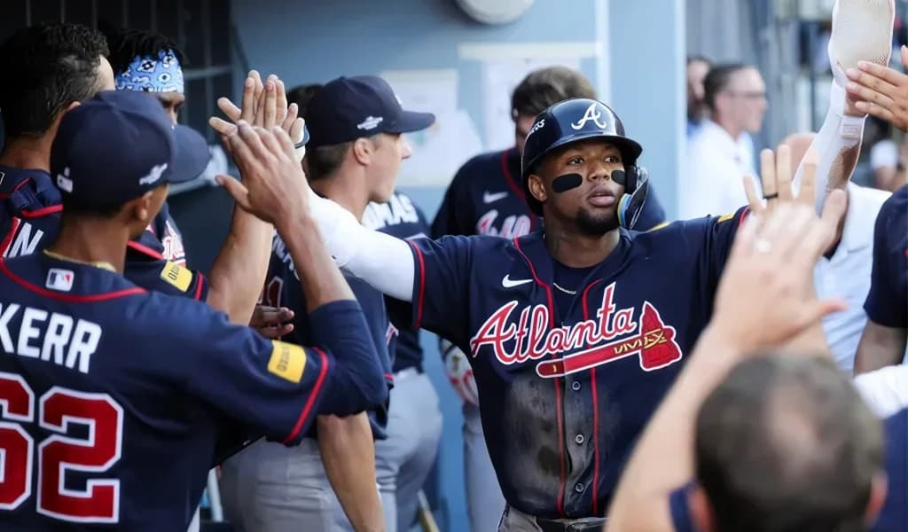 Ronald Acuna Jr. gets high fives in the Atlanta Braves dugout